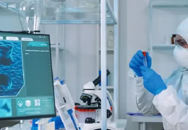 chemist-doctor-ppe-suit-working-pc-while-lab-technician-using-microscope-team-scientists-examining-vaccine-evolution-with-high-tech-researching-treatment-against-covid19-virus